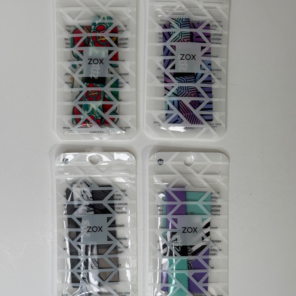 4 Zox stretchable bracelets with cards included. Size Medium